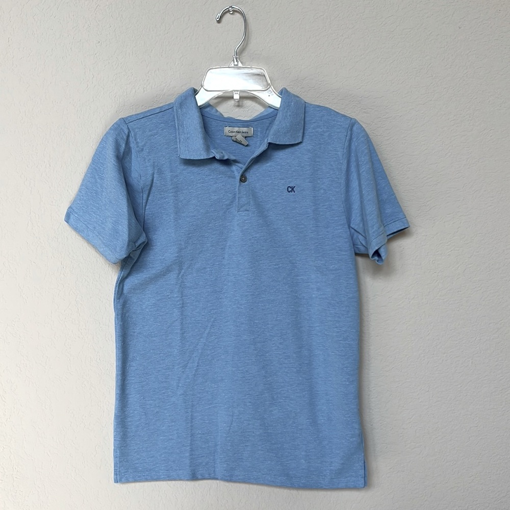 Boys Calvin Klein Jeans polo shirt in light blue size Large (14/16)